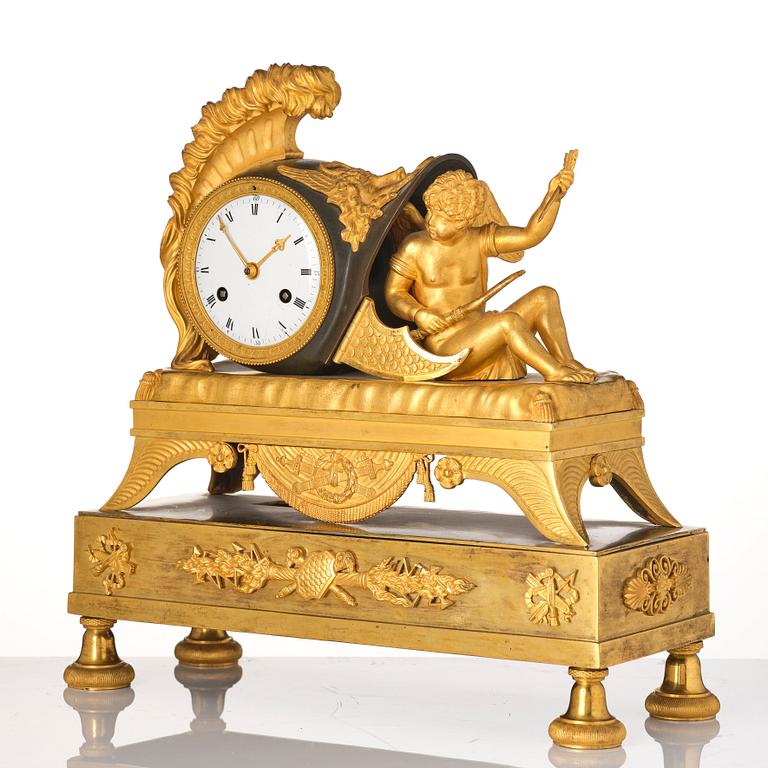 A French Empire sculptural ormolu and patinated bronze mantel clock, early 19th century.