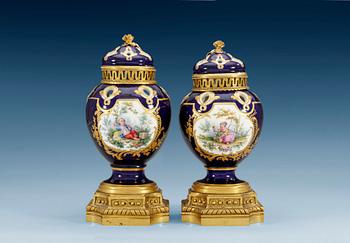 1249. A pair of gilt bronze mounted Sevres pot-pourri jars with covers, 18th Century. (2).