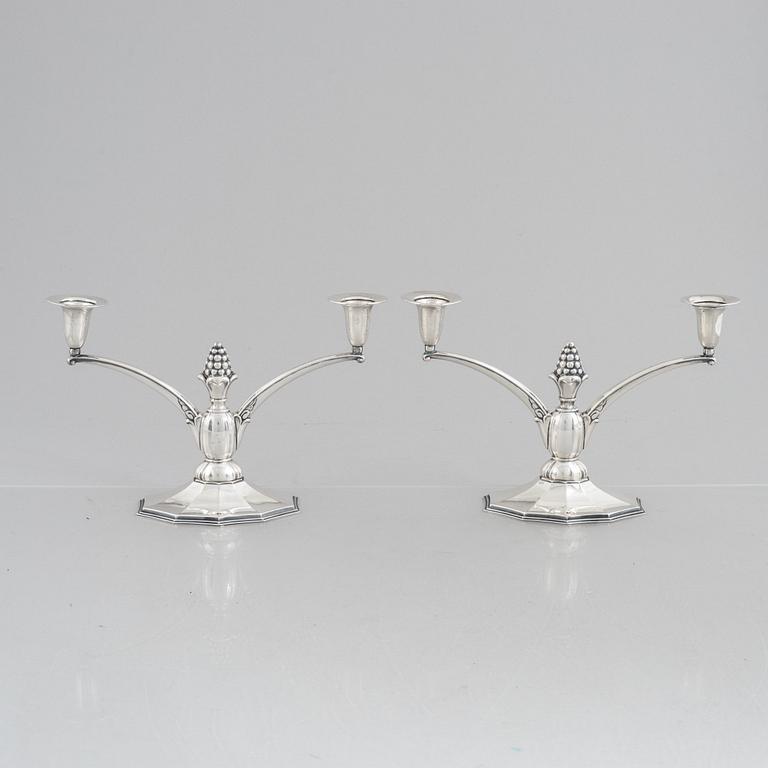 A pair of silver candelabra, Swedish import marks, probably 1920's/30's.