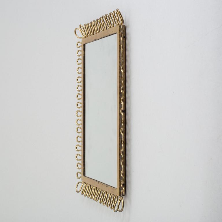 A first half of the 18th century brass mirror.