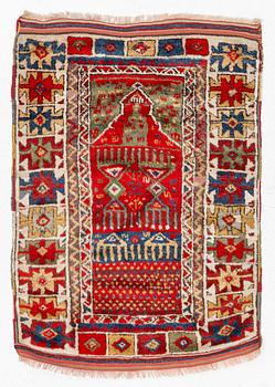 An antique Anatolian rug, c 136-147 x 104 cm (including flat weave).