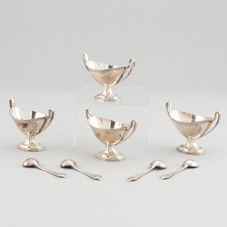 Four silver salt cellars with spoons, Edward Barnard & Sons Ltd, London, England, 1880.