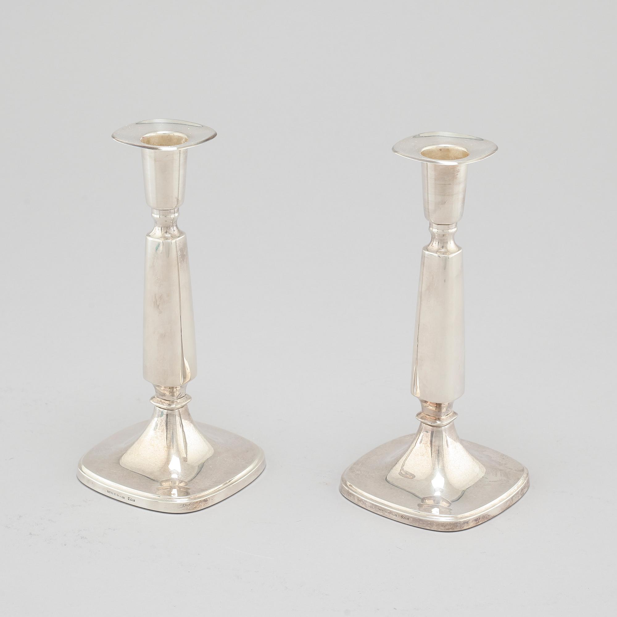 A pair of silver candlesticjs by Tore Eldh for K&EC in Gotheburg, 1970.