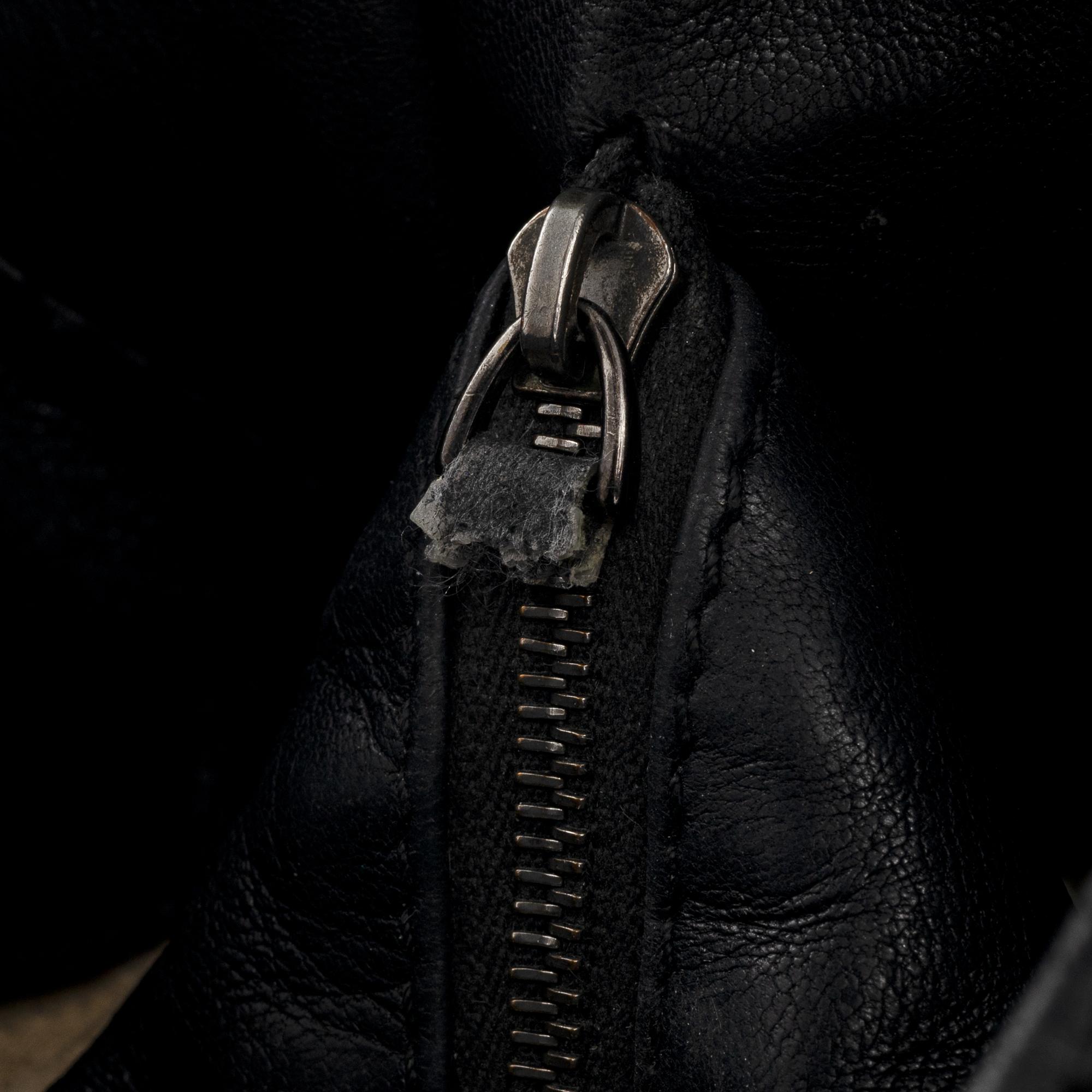 Bottega veneta, a black leather bag.