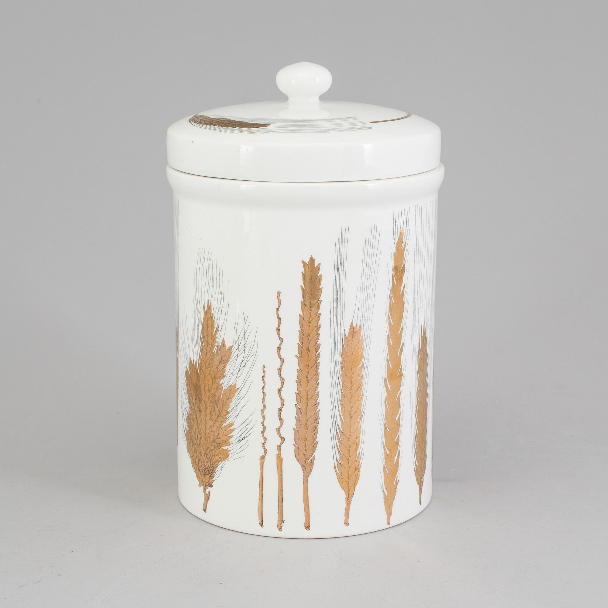 A porcelain jar with lid from Fornasetti, Italy.