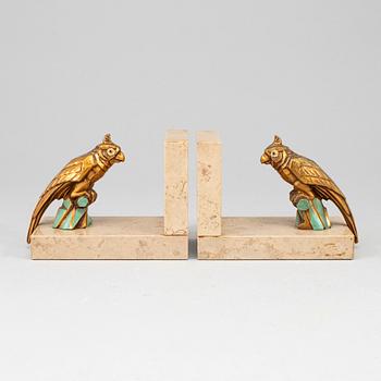 A pair of art déco painted metal and marble books ends, 1930s.