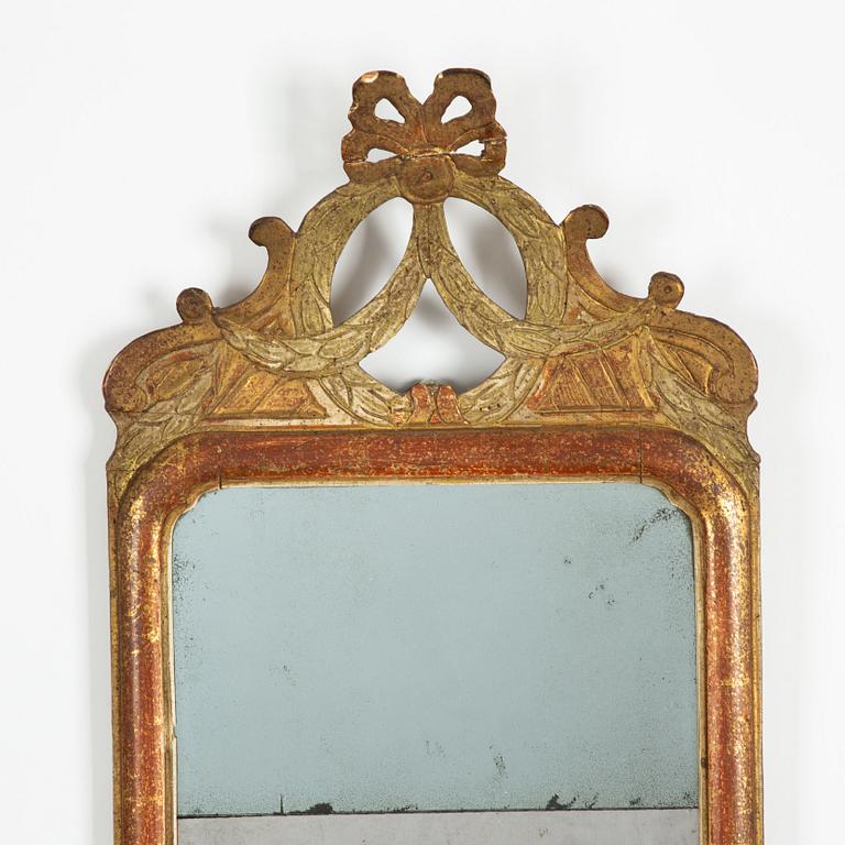 A  Gustavian giltwood one-light girandole mirror by N. Sundström (master in Stockholm 1754-1781).
