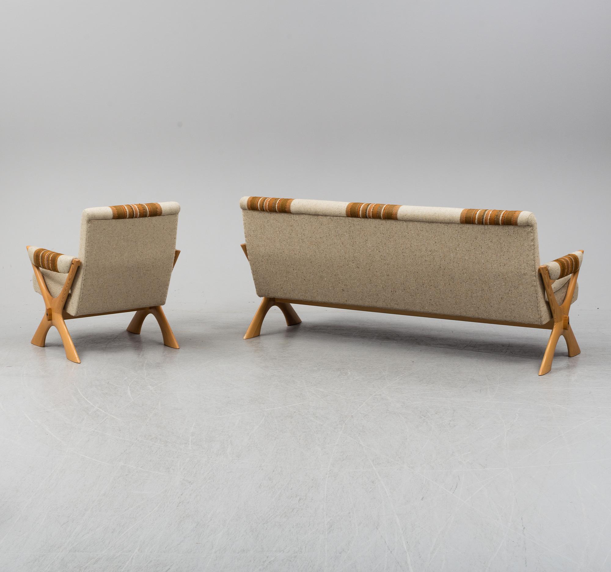 A 1960/70's pine sofa, armchair and coffee table.