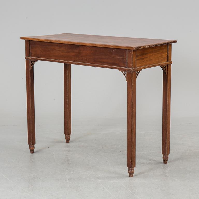 In the manner of the artist, a early 19th century late Gustavian table veneered with mahogany.