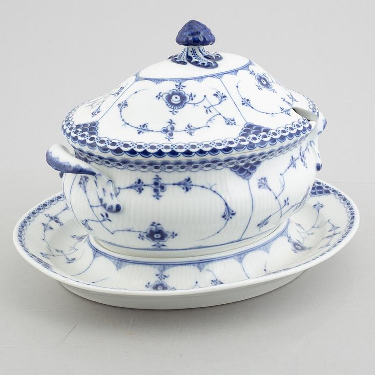 A porcelain 'Blue fluted half lace' / 'Musselmalet' tureen with cover and stand, Royal Copenhagen, 19th century.