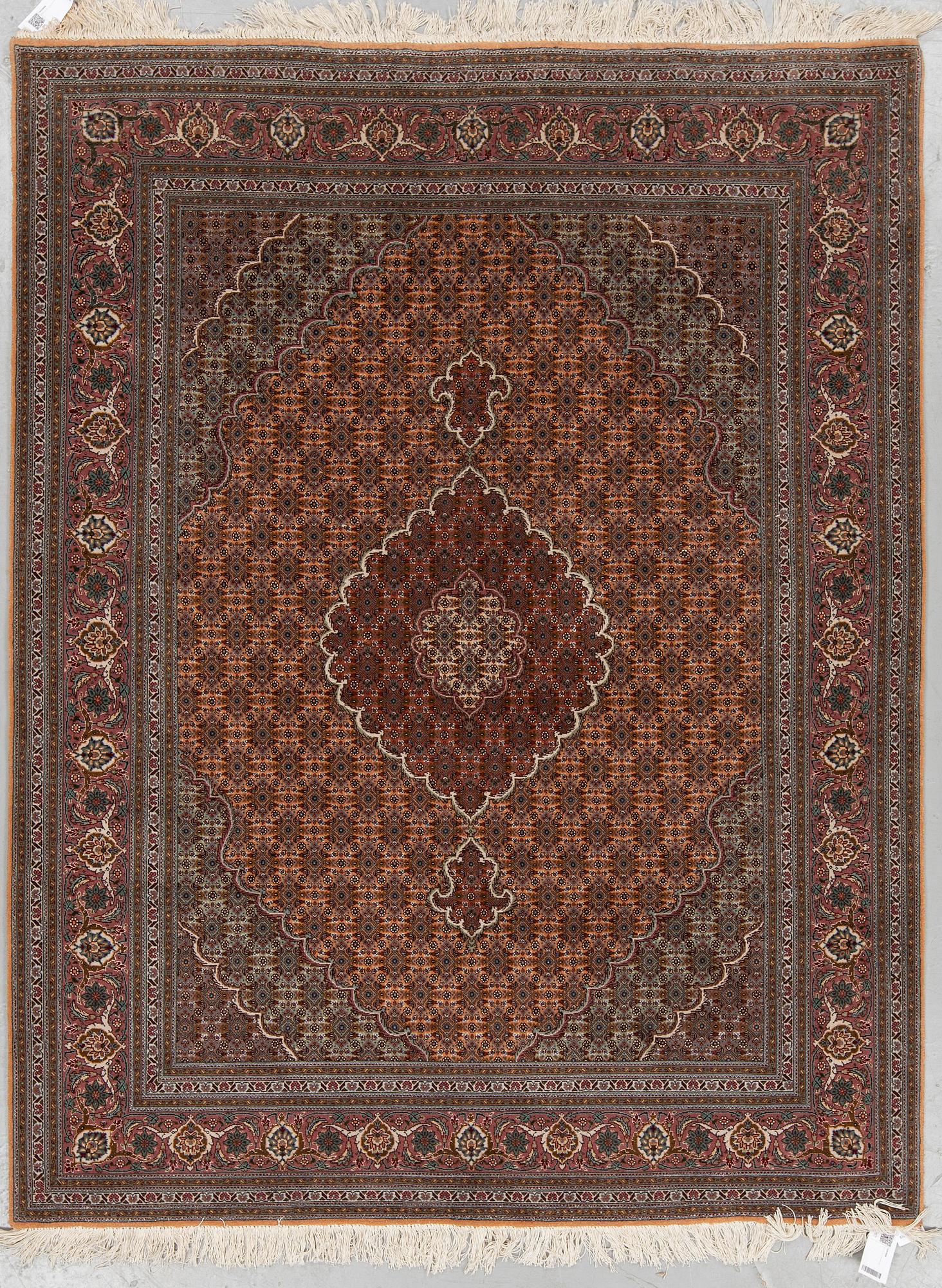 A RUG, Old Tabriz, part silk, ca 201 x 152 cm.
