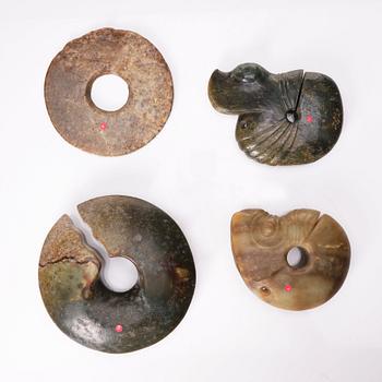 A group of four archaistic nephrite objects.