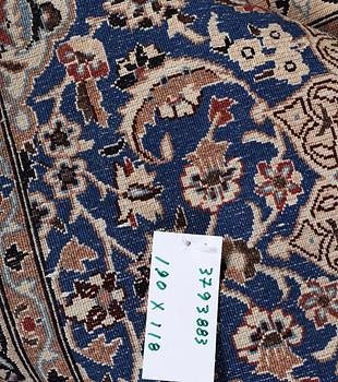 A Nain rug, part silk, 9 laa, c. 190 x 118 cm.