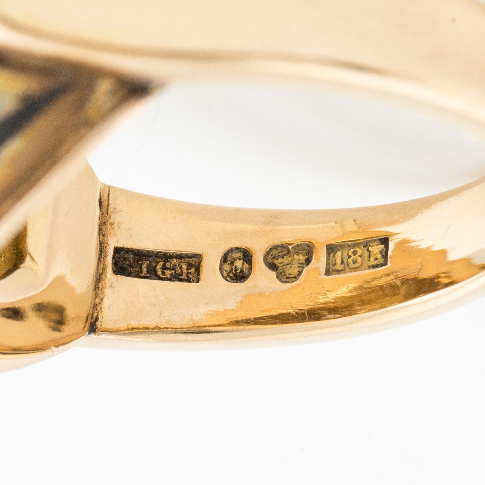 Sigurd Persson, a pair of earrings and a ring, 18K gold with enamel and round brilliant-cut diamonds, Stockholm 1955.