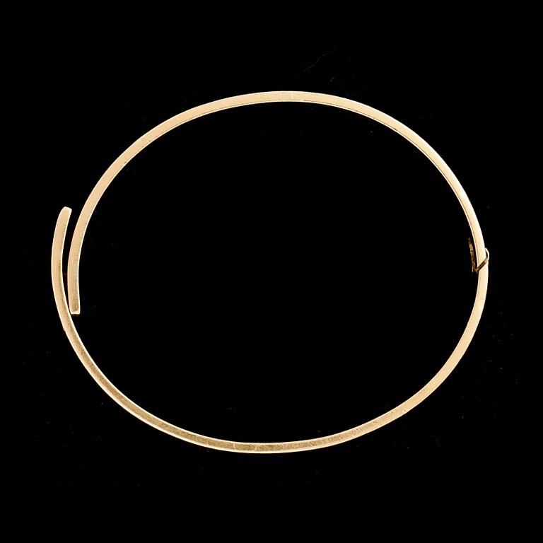ARMRING, 18k guld besatt med diamant, ca 0,05 ct. Cartier. Vikt ca 39 g.