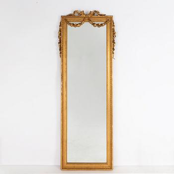 A Gustavian style mirror with table, circa 1900.