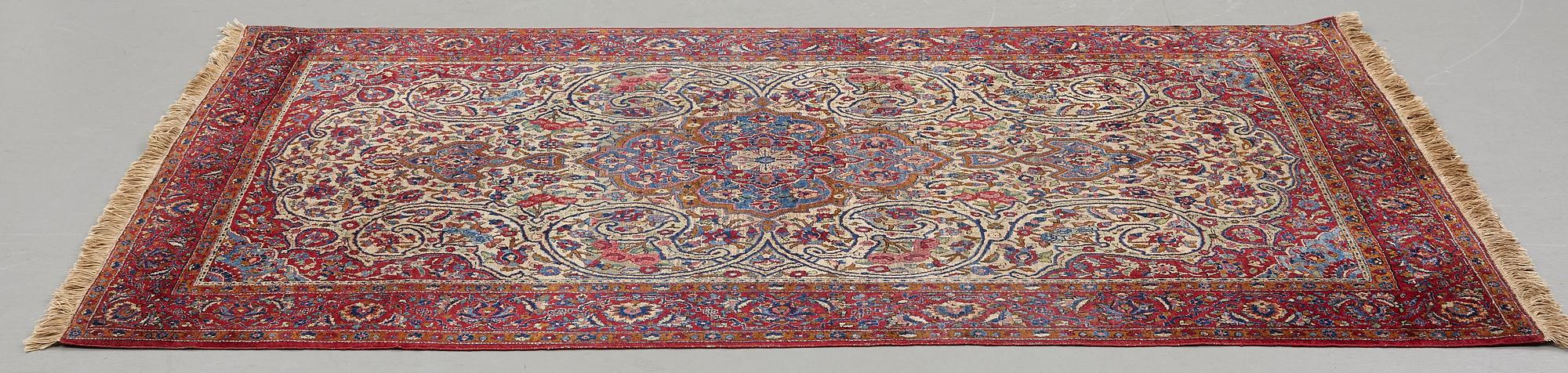 Matto, a semi-antique silk Kashan, ca 212,5-214,5 x 134,5-135,5 cm.