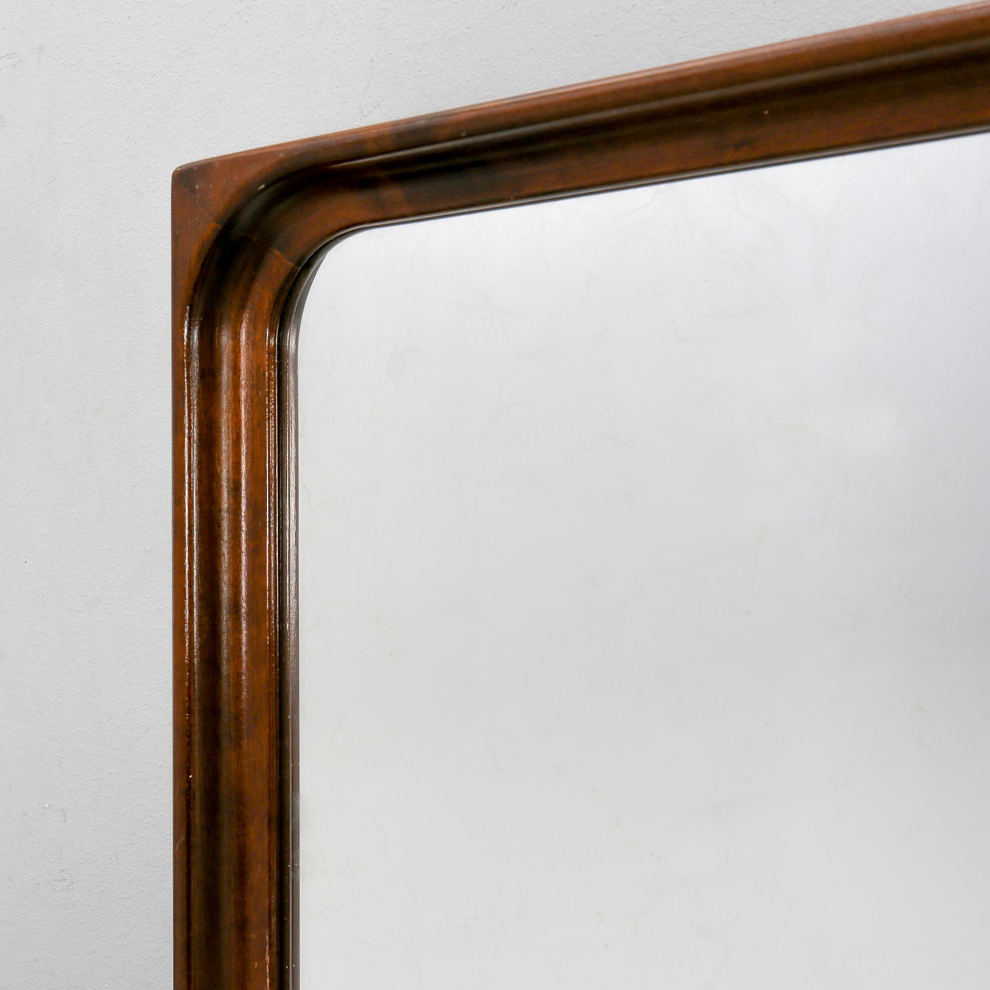 A 1940/50s  walnut mirror.