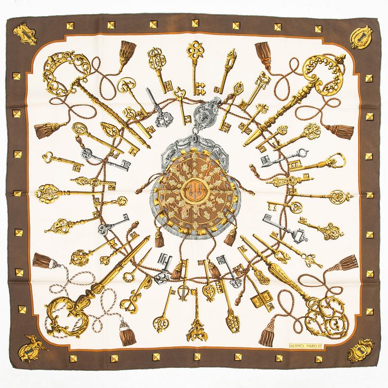 Hermès, Two silk scarves, 'Les Voitures a Transformation' and 'Les Clefs'.