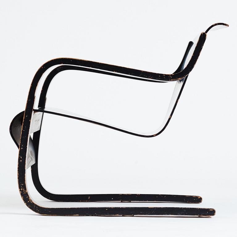 Alvar Aalto, a black lacquered birch cantilevered armchair, "nr 42", O.y Huonekalu-ja Rakennustyötehdas, Finland, 1930's.