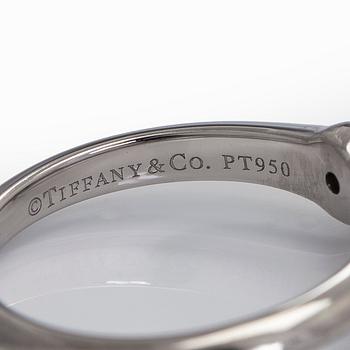 Tiffany & Co, a platinu solitaire ring with a brilliant-cut diamond.