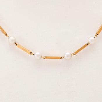 A set of 18K gold necklace and earrings with cultured pearls.