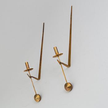 A pair of wall brass scones by Pierre Forsell.