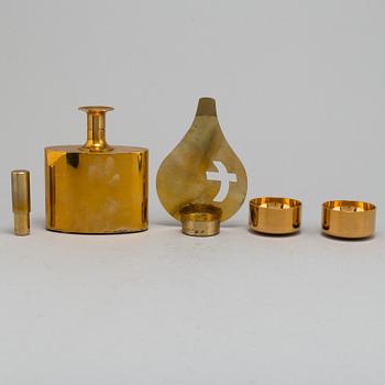 PIERRE FORSSELL, six gilt brass cups and a bottle, as well as candle holder, from Skultuna Bruk.