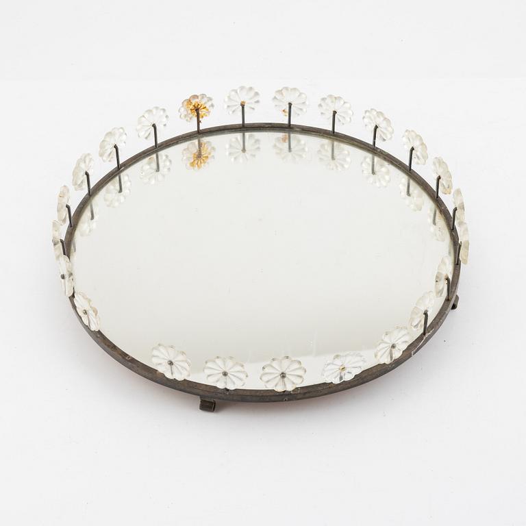 Estrid Ericson, a mirrored brass surtout de table from Firma Svenskt Tenn.