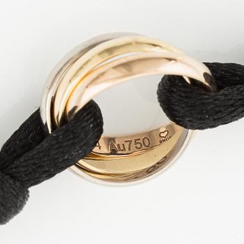 A Cartier "Trinity" bracelet, 18K three colour gold and textile.