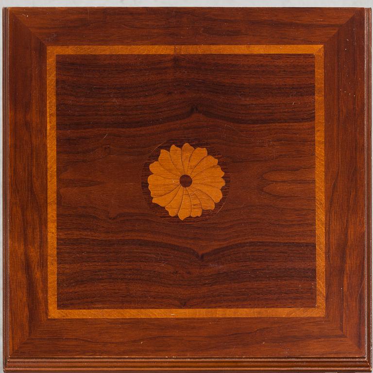 A mahogany veneered revolving bookcase, late 20th Century.