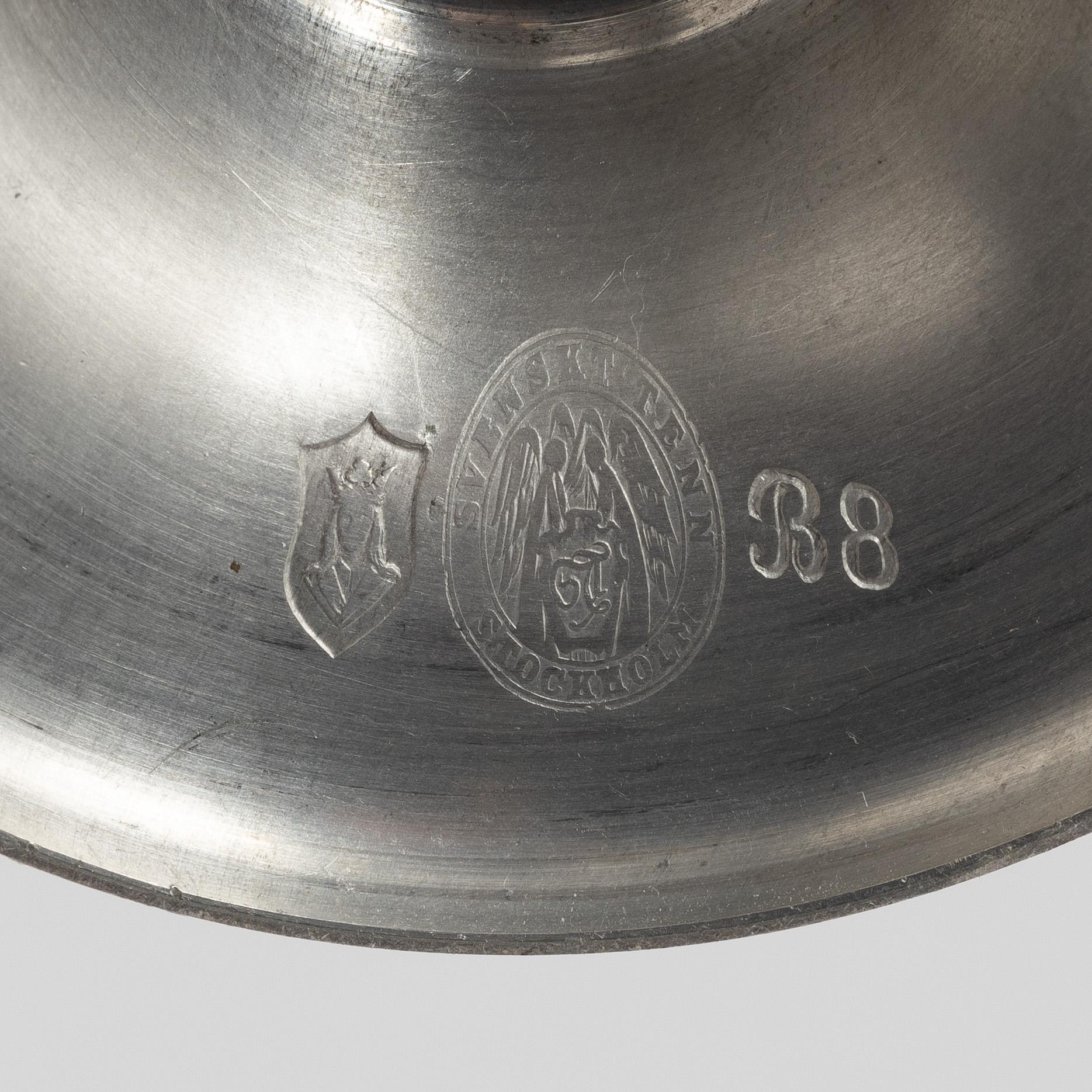 A pair of pewter candle sticks, model A702, Firma Svenskt Tenn, Sweden, 1928.