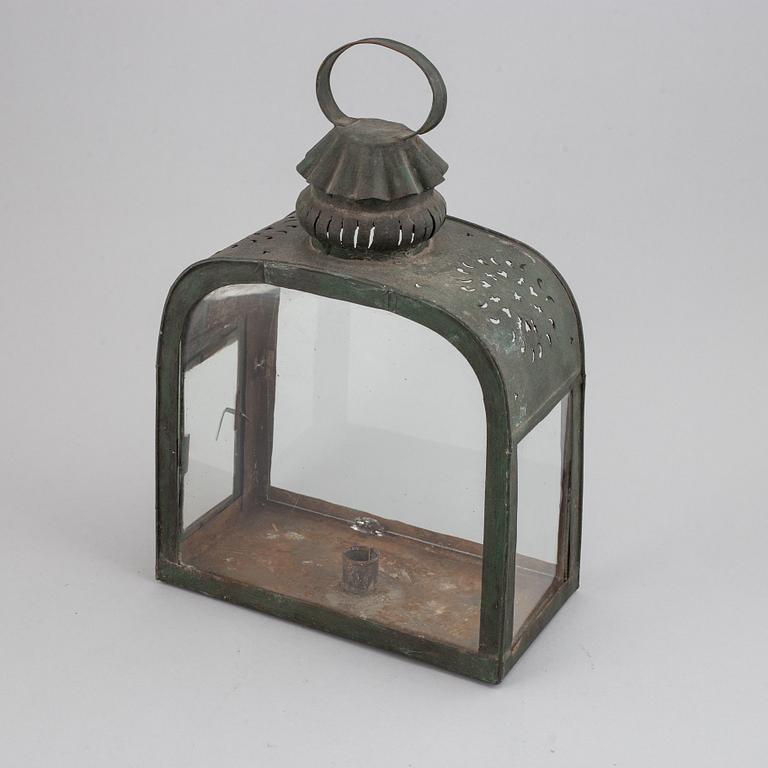 An 18th century tinplate and glass lantern.