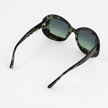 Oliver Goldsmith, a pair of green "Uuksu" sunglasses.