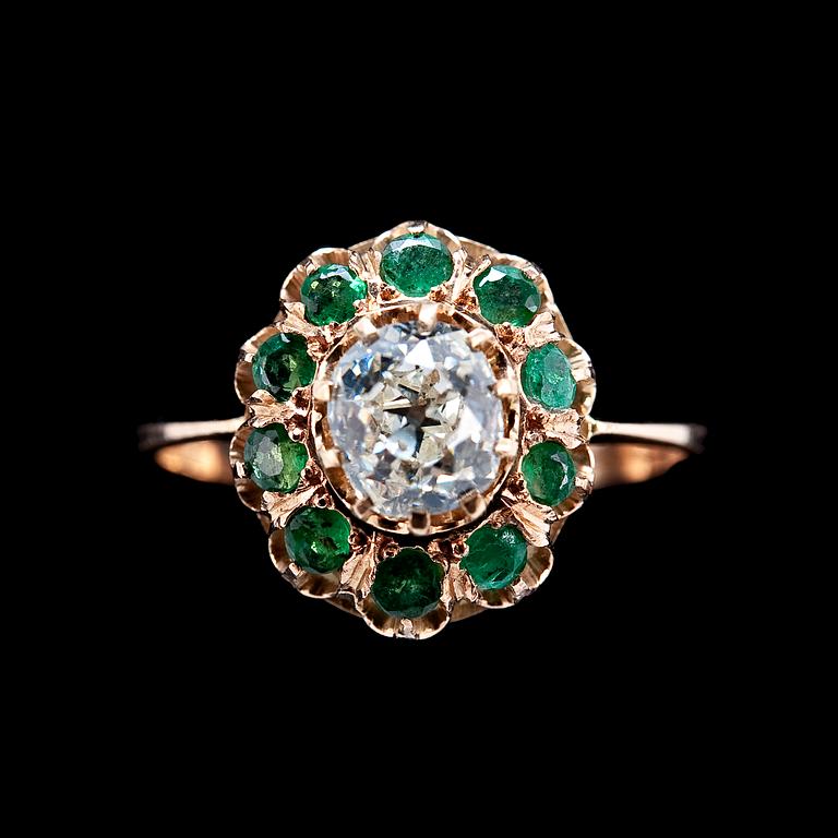 A RING, old cut diamond c. 0.70 ct and emeralds.