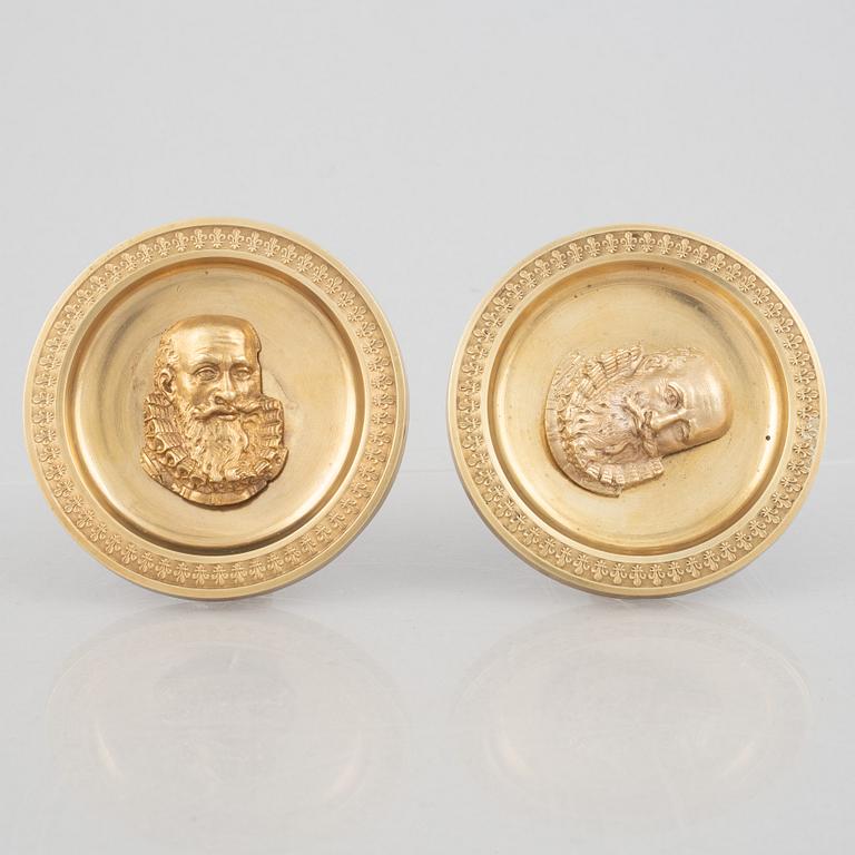 A pair of gilt-bronze Empire-style curtain holders, 19th century.