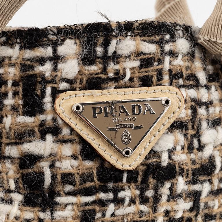 Prada, a tweed and leather bag.