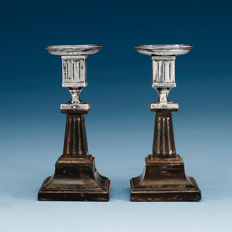 A pair of Swedish early 19th century silver and wood candlesticks, marks of Lorenz Georg Weis, Norrköping (1791-1829).