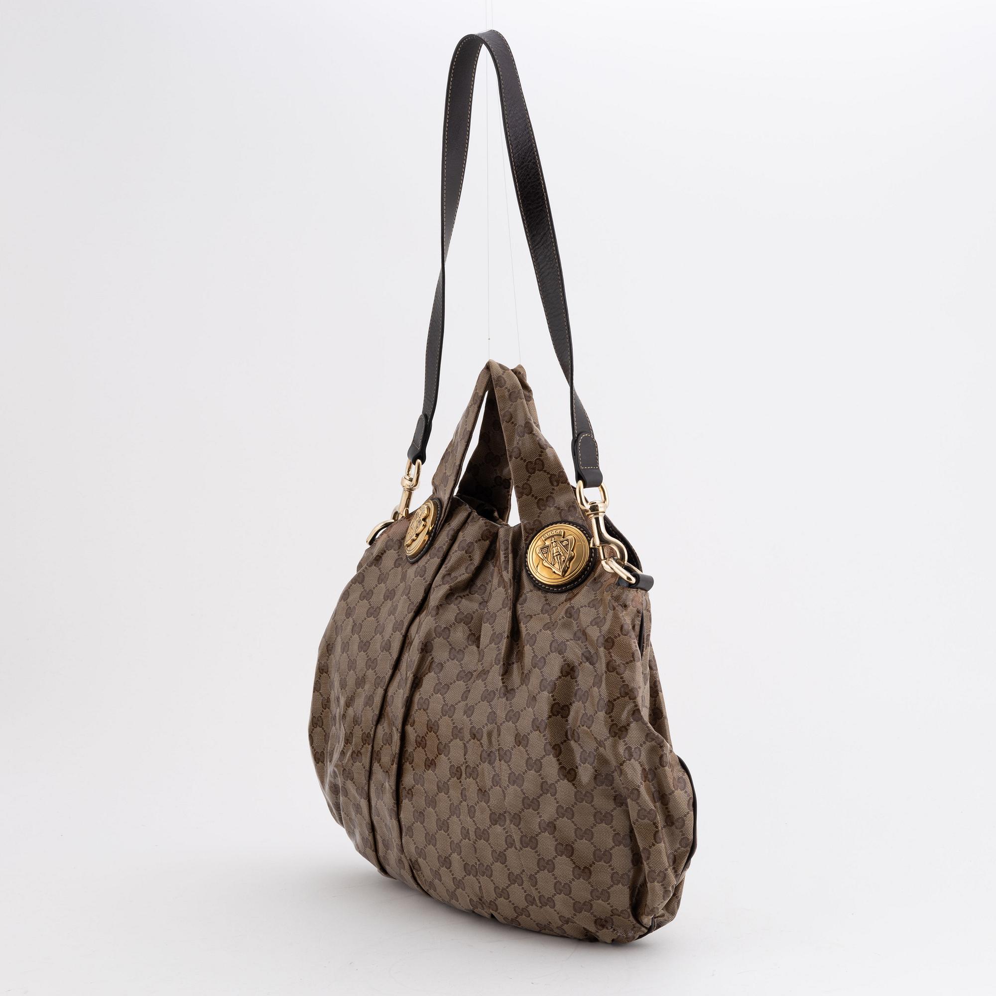 Gucci, a canvas handbag.