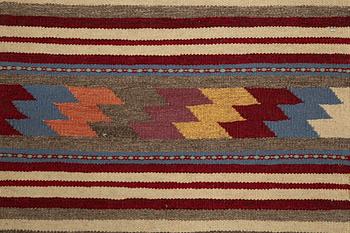 A persian kilim runner, c 246 x 64 cm.