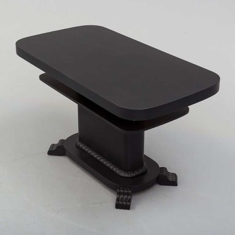 a coffee table from the first half of the 20th century.