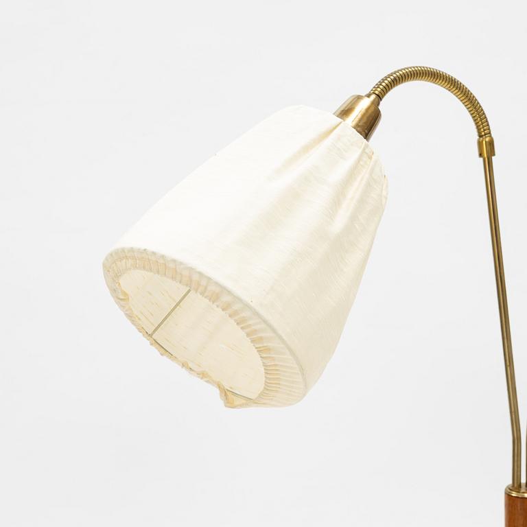 A brass and teak floor light, 1950's.