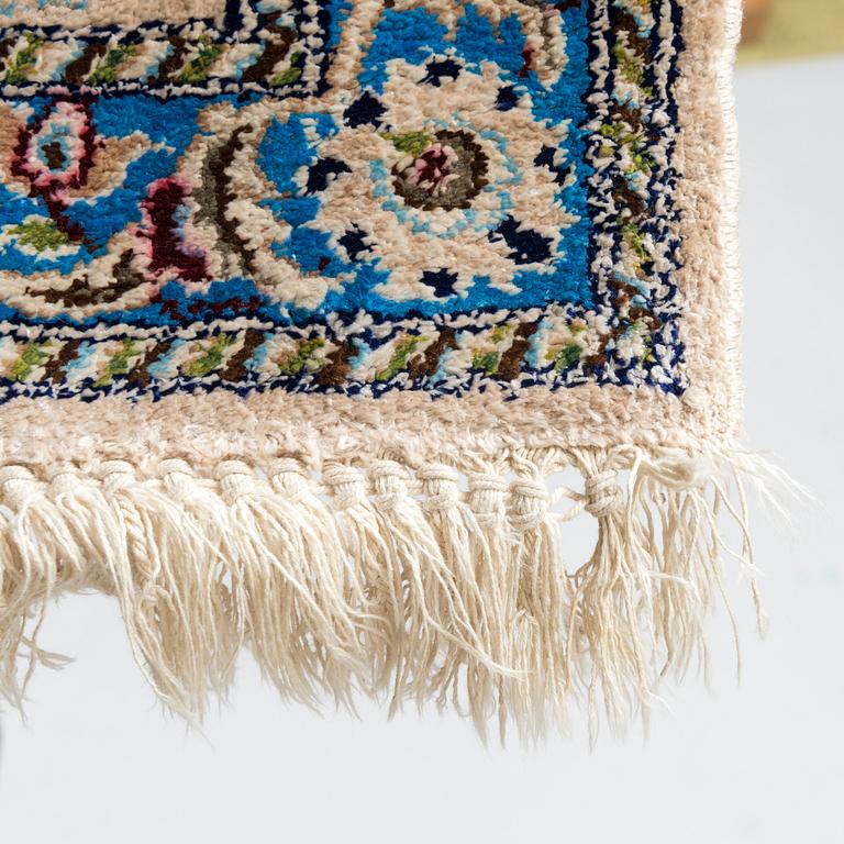 A oriental signed Nain silk carpet. Circa 267x163 cm.