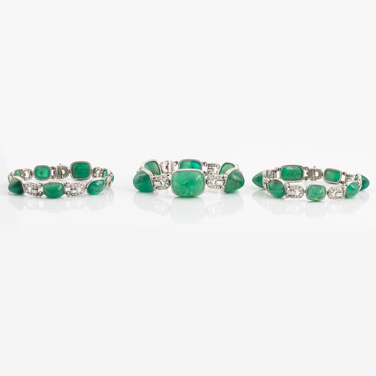 An art deco platinum necklace/bracelet combination with cabochon-cut emeralds.