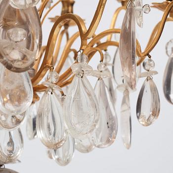 A Louis XV-style rock crystal eight-light chandelier, 20th century.