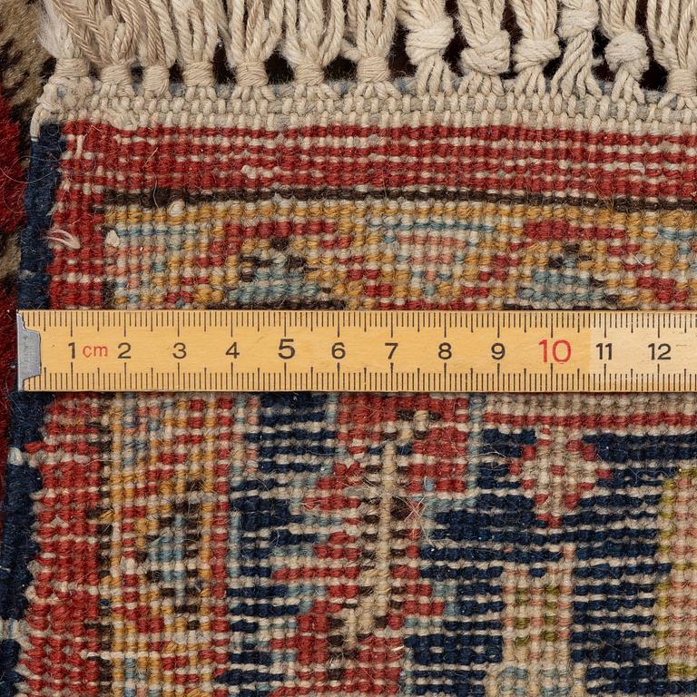 A semi-antique Kurdish runner, 350 x 140 cm.