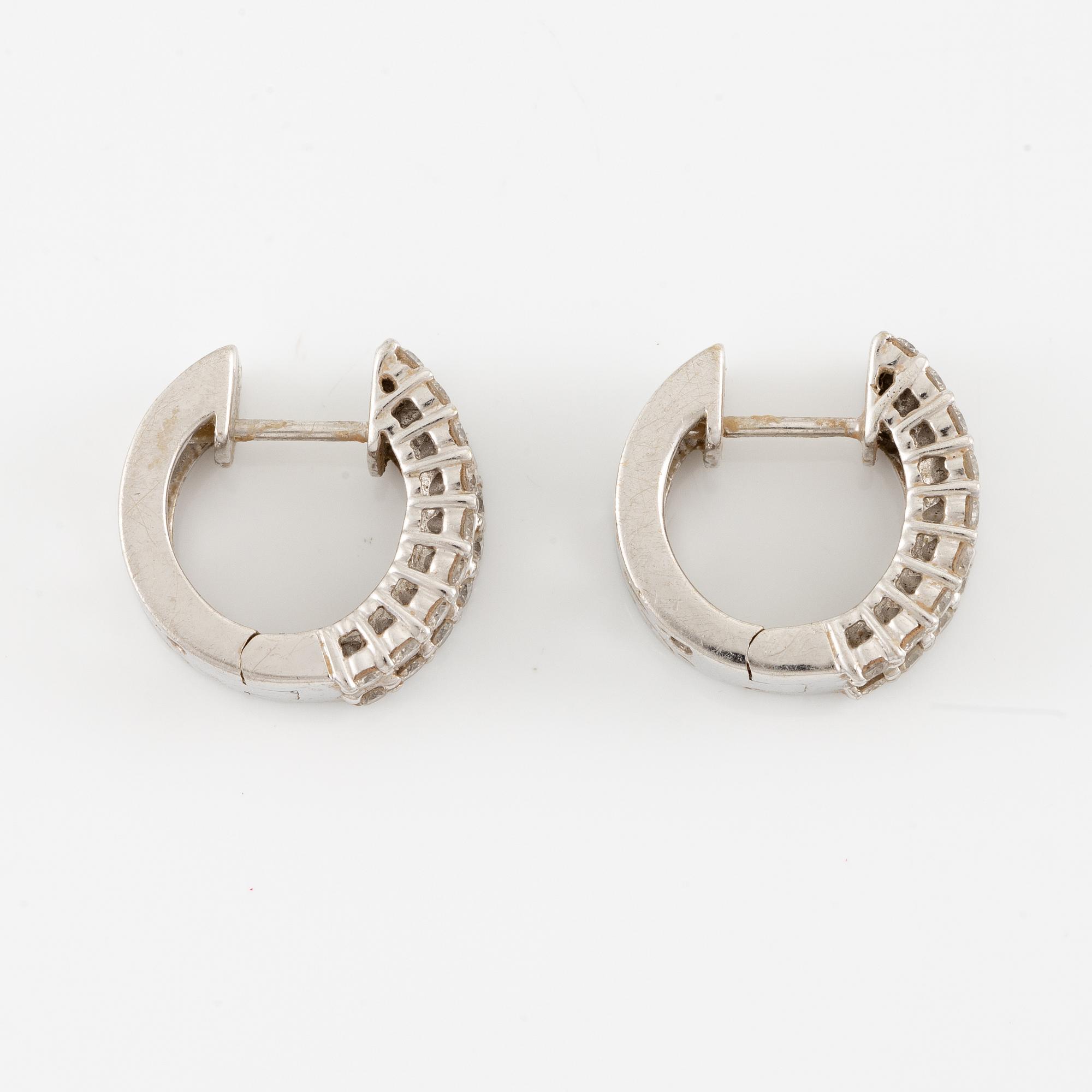 Earrings, a pair, 18K white gold set with baguette and brilliant-cut diamonds.