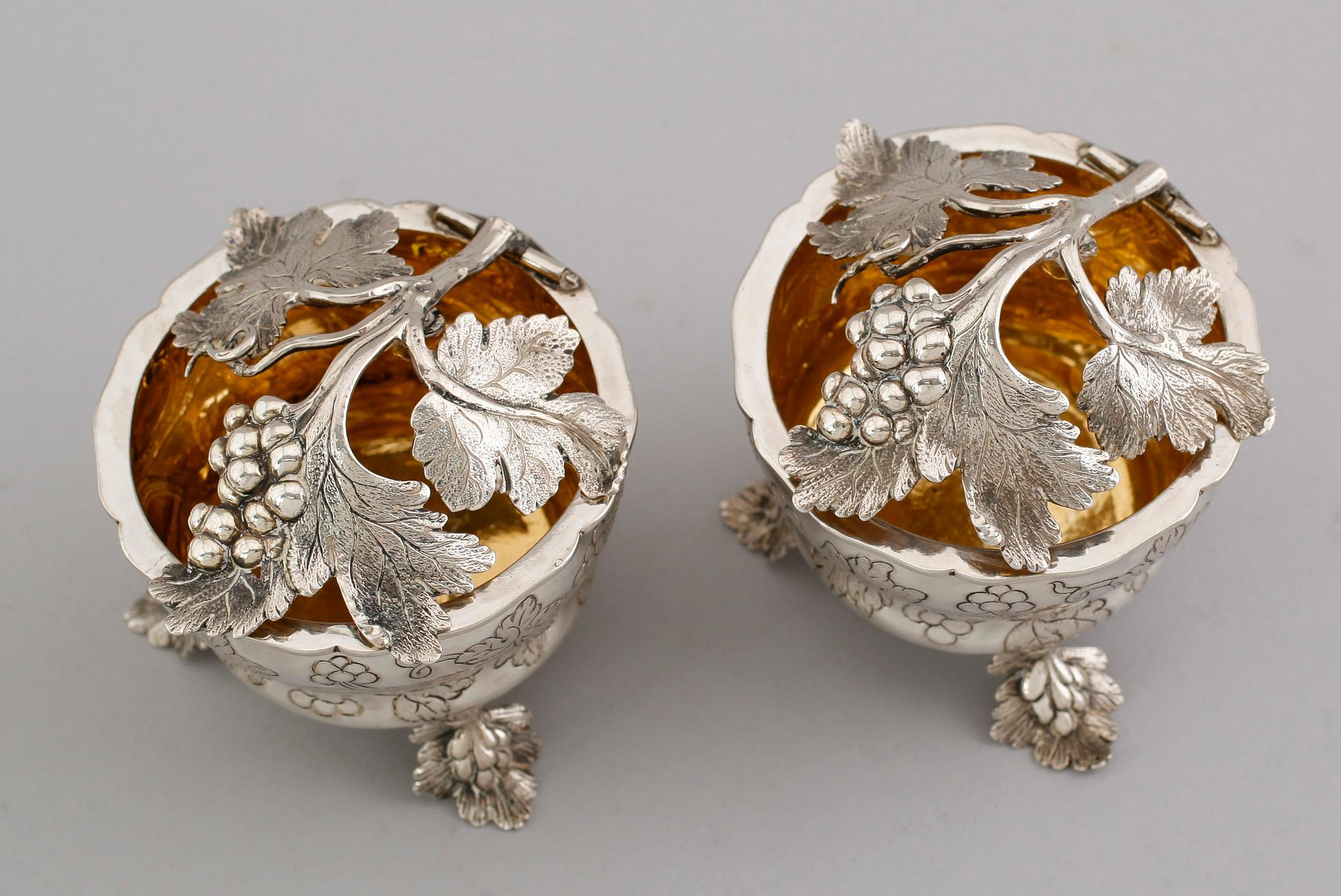 A pair of German 18th century parcel gilt jelly-pots, marks of  Johann Christoph Seelingslow, Magdeburg.