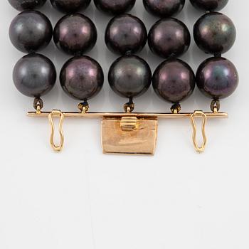 Necklace, five-row with cultured black pearls, 18K gold and white gold with brilliant-cut diamonds.