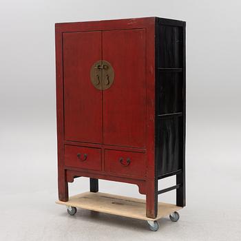 A red-lacquered cabinet, China, 20th century.